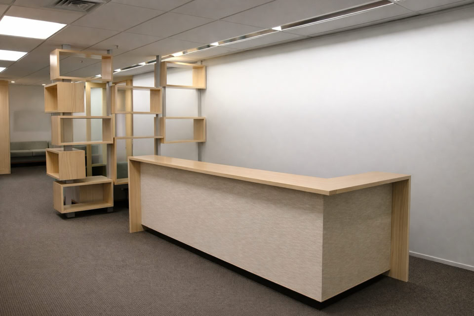 Room with a long wooden counter and wooden shelving units against a white wall.Millbrook Furniture design partnerships NZ, Millbrook collaborative design services, Millbrook joinery design partners, Millbrook Furniture architect partnerships, design collaboration furniture NZ, Millbrook bespoke design collaboration, Millbrook Furniture trade partnerships NZ, Millbrook furniture and architecture collaboration, Millbrook custom joinery design partners, Millbrook furniture designer network NZ, Millbrook Furniture partnership projects, Millbrook Furniture industry partnerships NZ, bespoke joinery for designers NZ, Millbrook Furniture design collaboration Hastings, Millbrook Furniture supplier partnerships NZ, Millbrook Furniture custom design solutions, designer joinery collaboration NZ, Millbrook Furniture partner services, Millbrook Furniture collective design work, Millbrook Furniture and design professionals NZ, Millbrook Furniture architectural joinery NZ, Millbrook Furniture design partner program NZ, Millbrook Furniture trade services and partnerships, Millbrook Furniture bespoke projects with designers, Millbrook Furniture collaborative projects NZ.